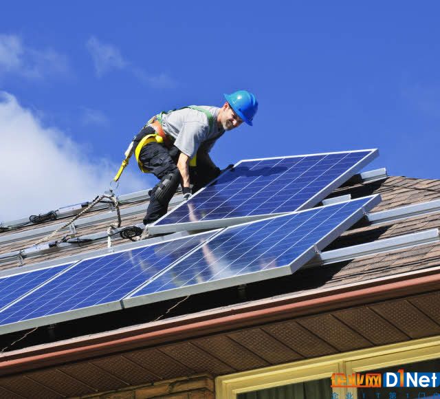 installing-solar-panels-on-a-roof.jpg